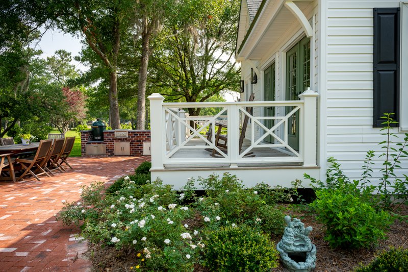 Landscaping functions as a critical layer of protection that helps defend coastal homes against natural forces.