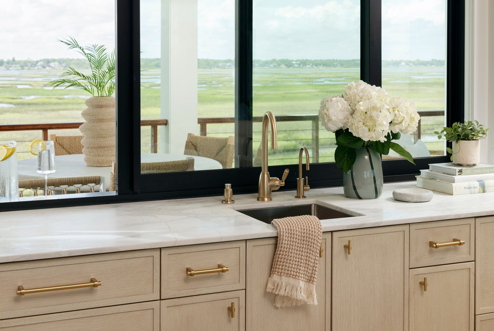 Large windows facing kitchen counter and sink